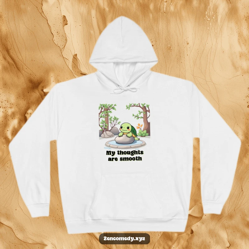 Funny Zen Turtle Hoodie showing a relaxed turtle meditating in a zen garden, contemplating a smooth stone, offering cozy vibes.